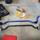 Here you see the OEM sway bar below the SuperPro sway bar, with the SuperPro endlinks in the yellow bag above. Crow bar was not needed for the brackets (seen here still on the OEM bar bushings).